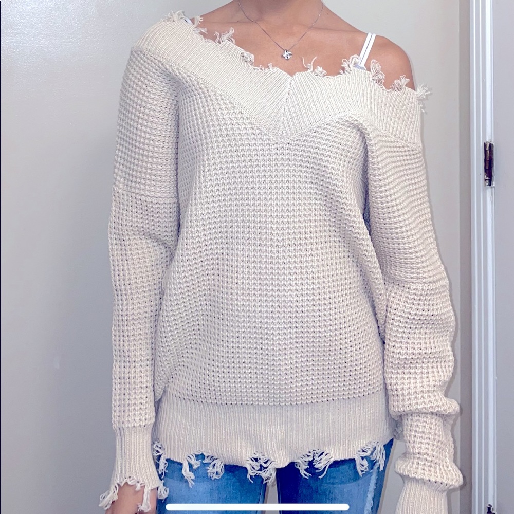 Xs frayed sweater but fits more like a small-medium